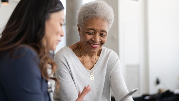 elderly woman speaking with doctor