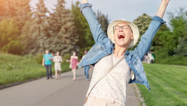 young person jumping for joy