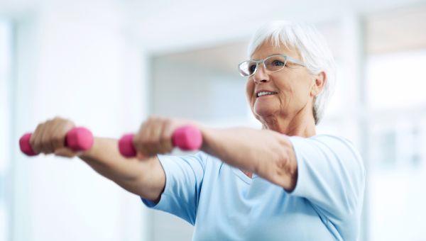 older woman with weights