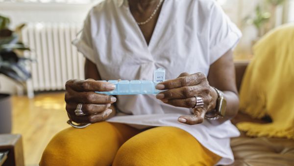 woman taking pills