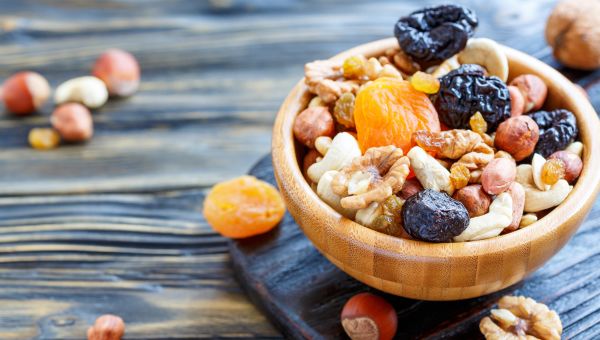 a bowl of nuts and dried fruit
