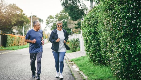 senior couple jogging outside