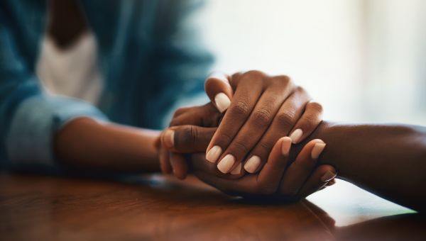 two people holding hands