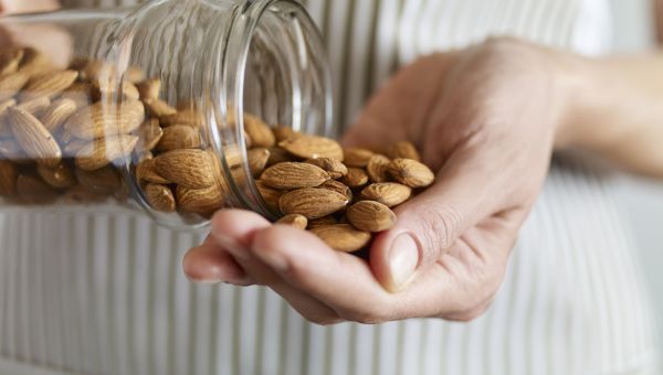 hands holding almonds