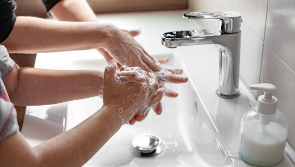 child washing hands