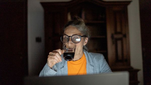 woman drinking coffee at night