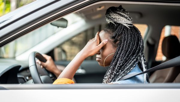 woman frustrated in her car