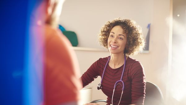 smiling doctor with patient