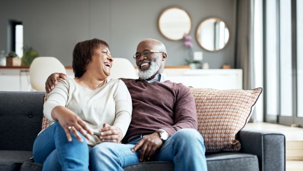 Happy mature couple relaxing at home