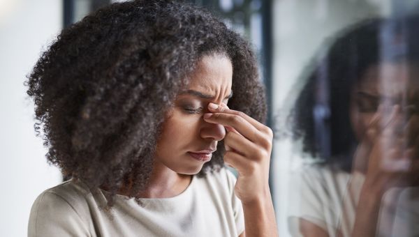 young woman with a headache