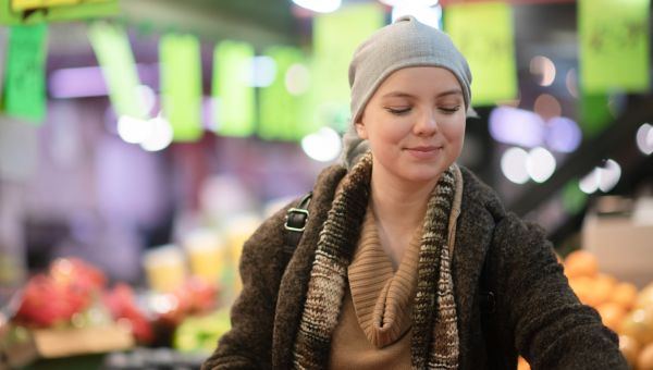 Someone with cancer shopping in the produce section