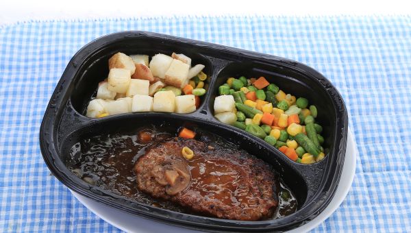 A frozen dinner with meat, vegetables, and potatoes that contains hidden added sugar