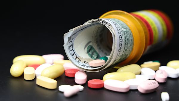 money stuffed in prescription bottle