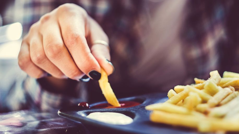 person eating french fries