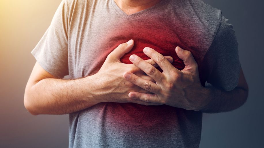 Red burst radiates as someone grasps their chest.