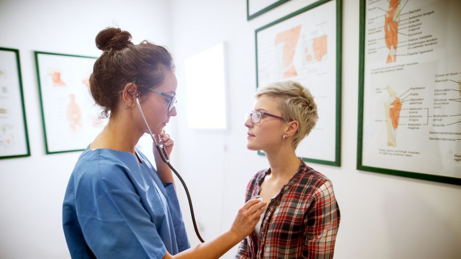 Woman talking to her doctor in his office