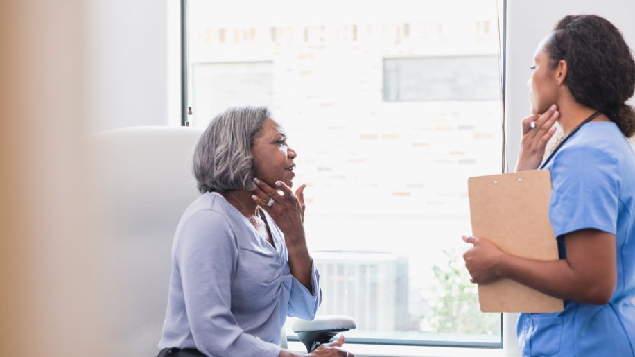 senior woman speaking to a dermatologist