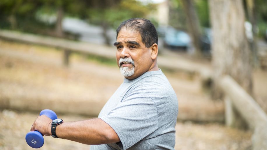 someone doing muscle strengthening exercises with light weights outside