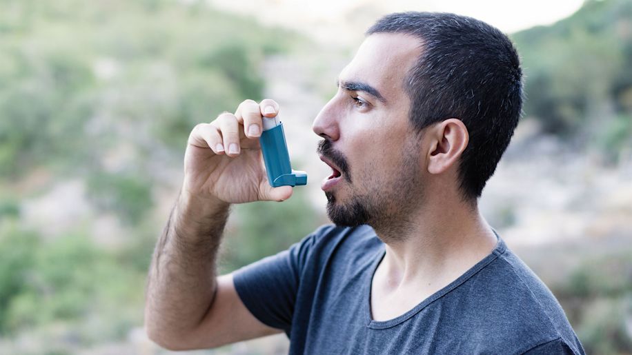 Man using inhaler