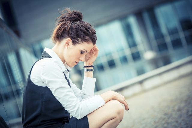 Tired or Depressed Businesswoman Outside