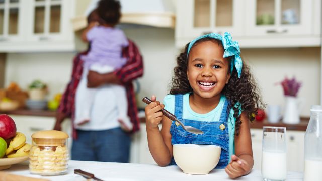 child eating breakfast