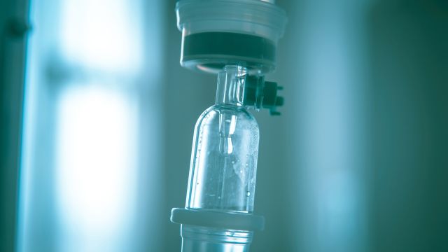 Close up IV saline solution drip for patient in hospital