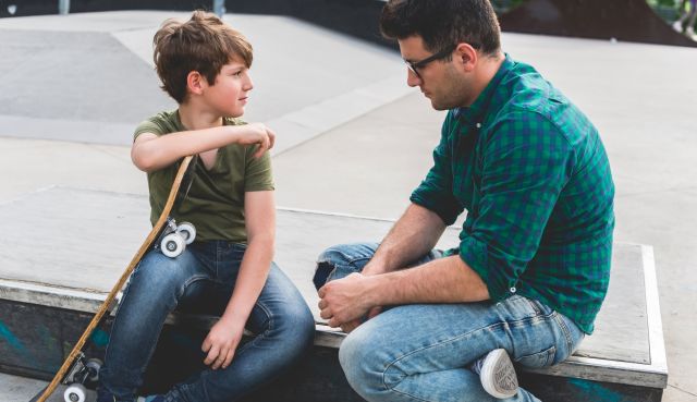 A father having a talk with his son about sexual harassment