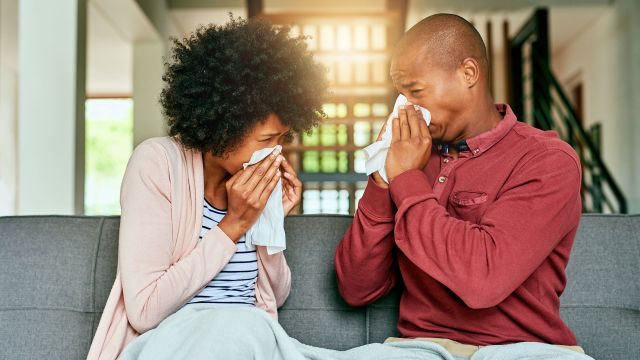 A couple blow their noses and wonders what you can do for a sinus infection—aside from OTC meds for sinus infections.