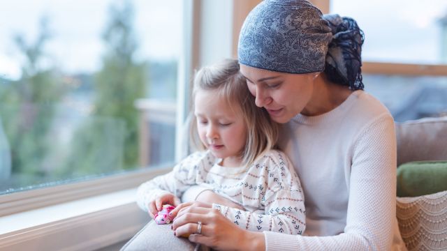 A woman being treated for metastatic breast cancer visits with her daughter.