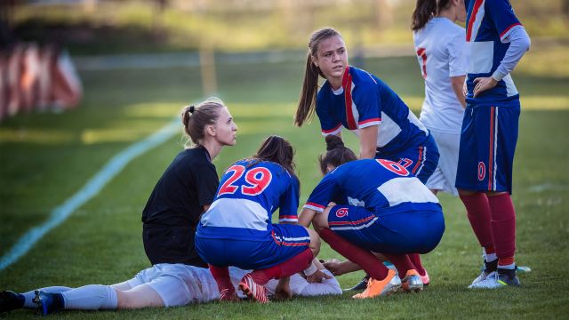 Young boy with a head injury at a soccer game