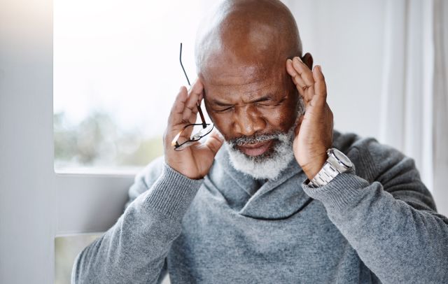 An older man with a severe headache wonders if his headache is a sign of a stroke, since headaches and strokes can be linked.