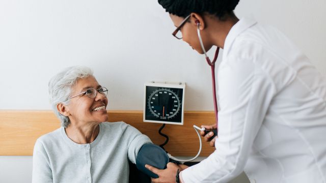 doctor taking blood pressure