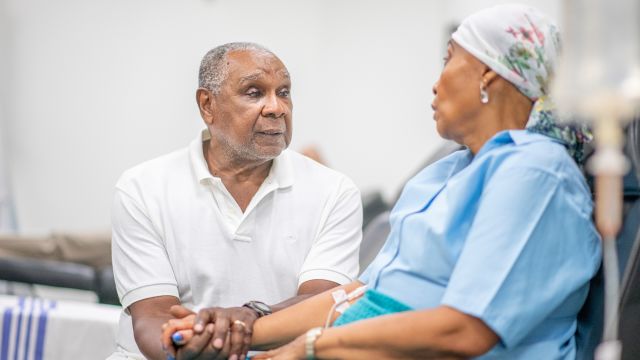 A husband comforting his wife after she was diagnosed with soft tissue sarcoma.