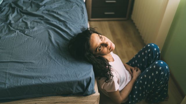 woman sitting alone in room