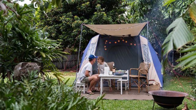 family camping in the backyard