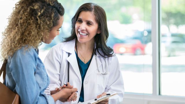 Woman talking with physician