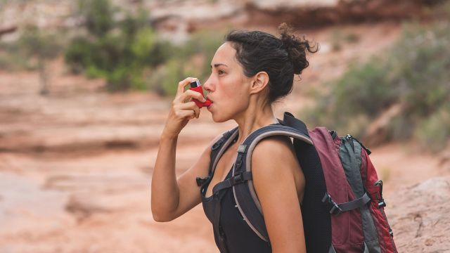 woman using inhaler