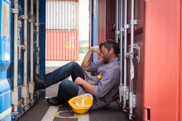 A worker struggles with fatigue on the job. Fatigue is a common complaint among hepatitis C patients.