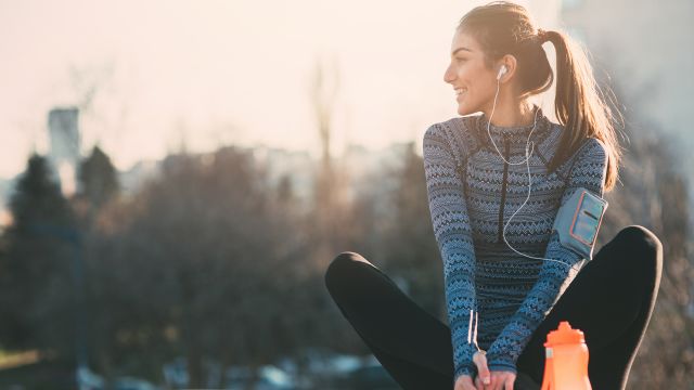 Young woman exercises outdoors