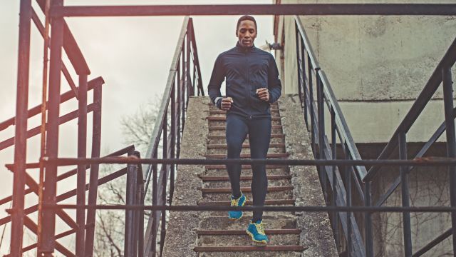 Man running up and down stairs for exercise