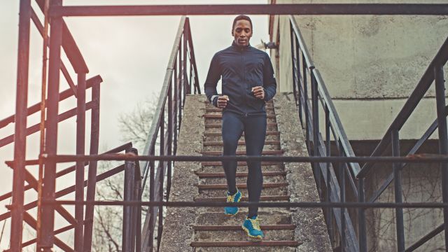 Man running up and down stairs for exercise