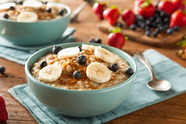 Homemade oatmeal with banana, blueberries and cinnamon.