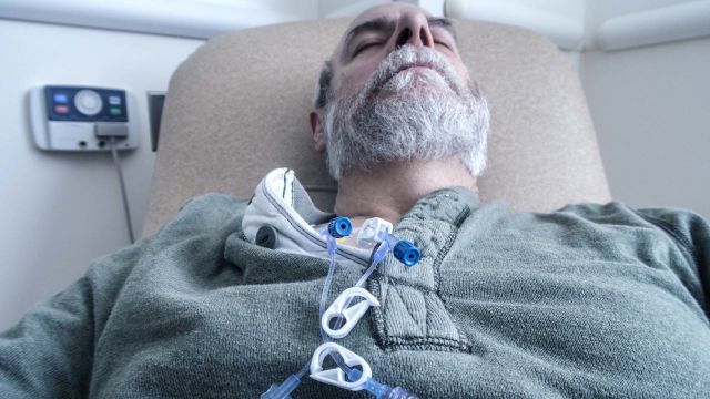 Older person lying in hospital bed