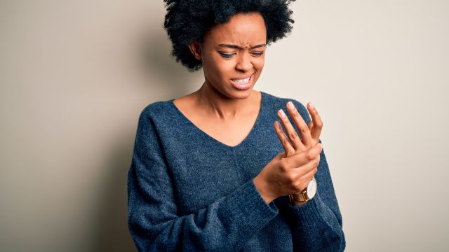 young woman with joint pain