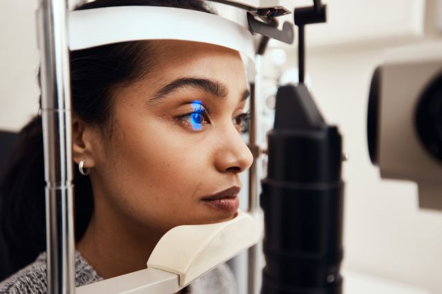 a young woman undergoes an eye exam