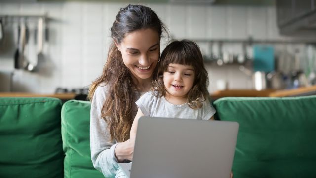 A parent and child use a laptop computer. NF affects people of all ages, and many NF patients are children.
