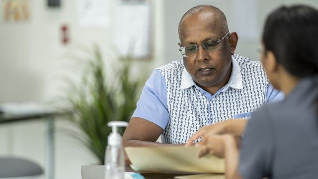 A patient consults a psychiatrist in their office.