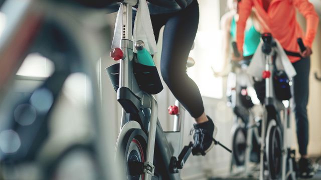 Women exercising on stationary bikes