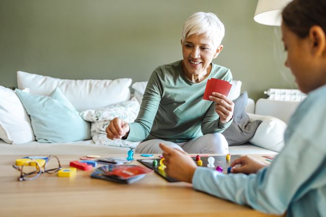 Activities like board games, card games, and building puzzles can help exercise the brain and encourage social interaction for people with Alzheimer's disease.