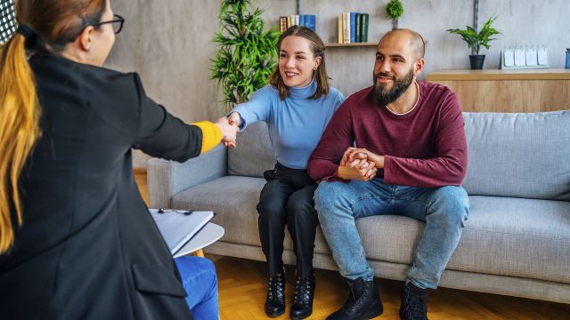 Two people talking with their fertility doctor